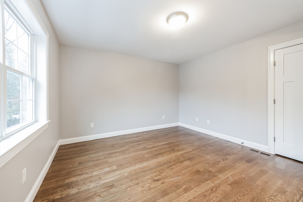 36 Gove Road Billerica, MA 01821 - Photo 24 of 30 an empty room with wooden floor and windows