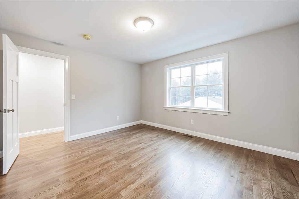 36 Gove Road Billerica, MA 01821 - Photo 25 of 30 an empty room with wooden floor and windows