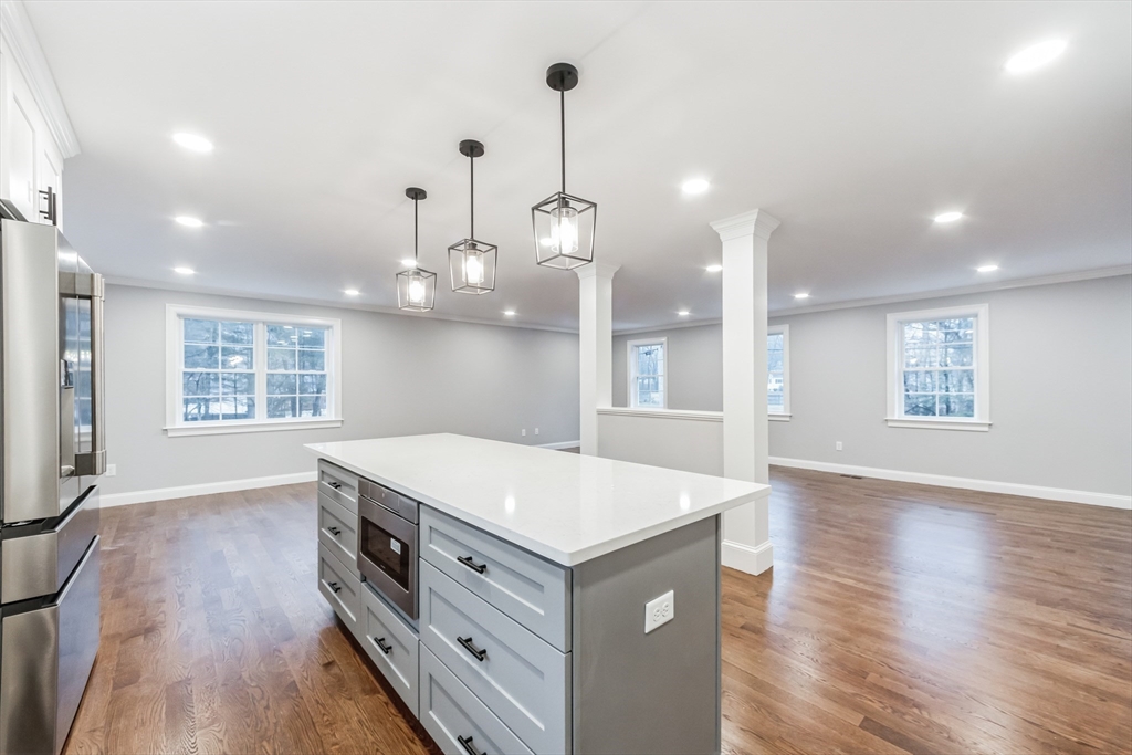 36 Gove Road Billerica, MA 01821 - Photo 7 of 30 a kitchen that has a lot of cabinets in it