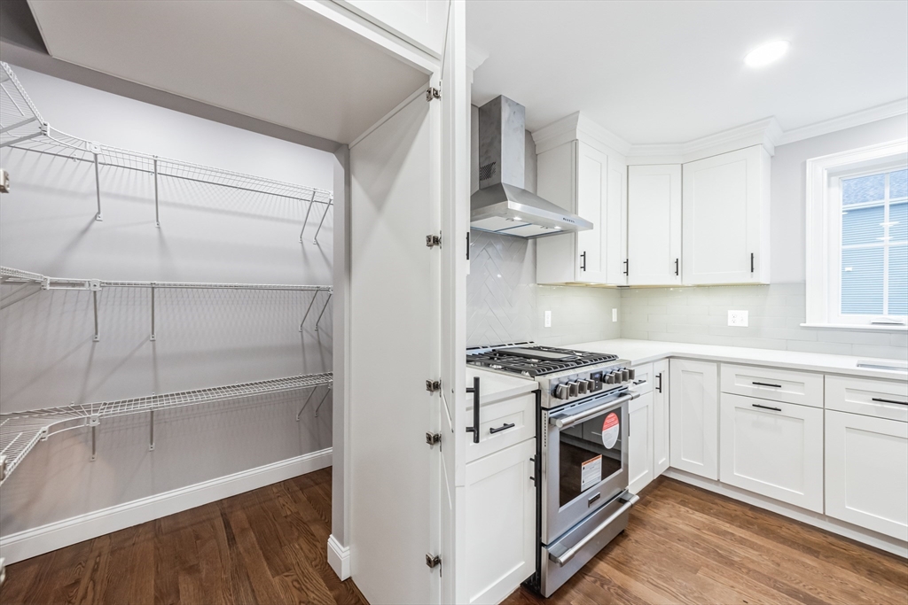 36 Gove Road Billerica, MA 01821 - Photo 8 of 30 a kitchen with cabinets a sink and appliances