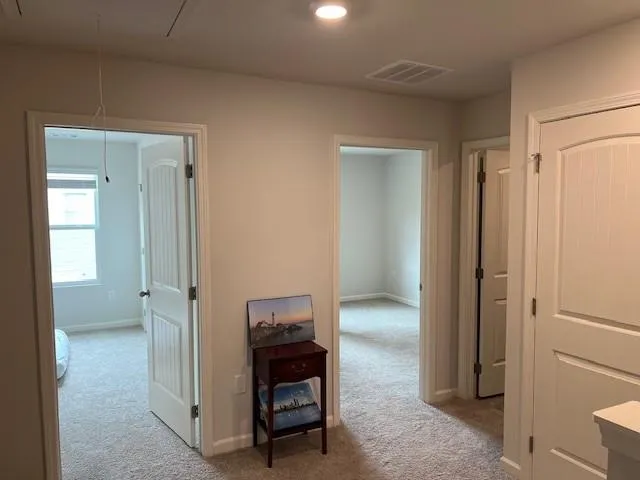 a kitchen with stainless steel appliances granite countertop a refrigerator a stove a sink dishwasher and a refrigerator with wooden floor