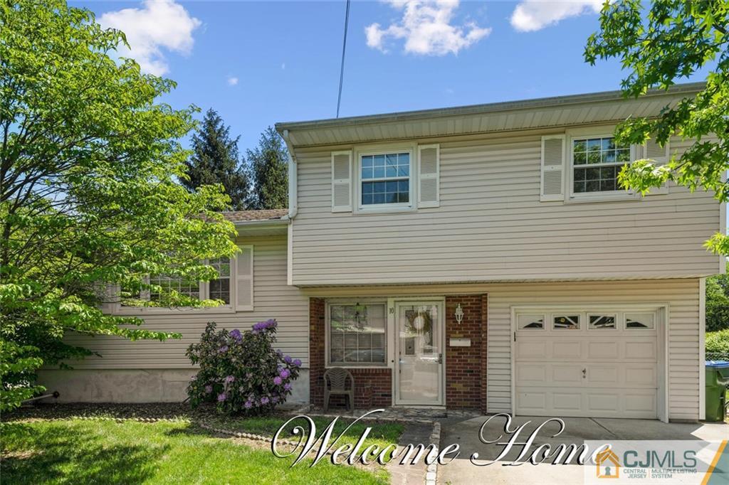 10 Monaghan Road Edison, NJ 08817 - Photo 1 of 23 a front view of a house with garden