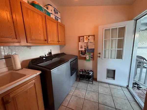 a utility room with dryer and washer