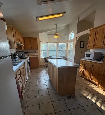 a kitchen with a sink a counter top space and appliances