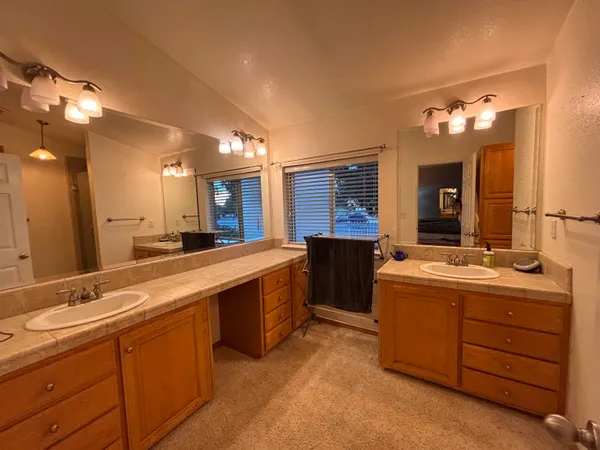 a large bathroom with a sink and a large mirror