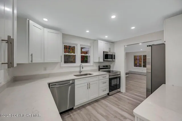 a bathroom with a toilet sink and shower