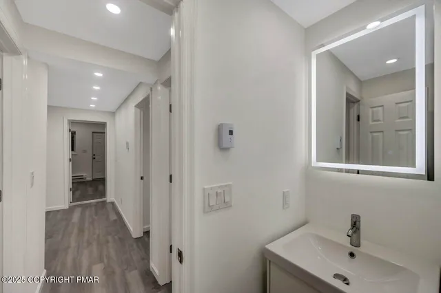 a house that has a tree in front of the house