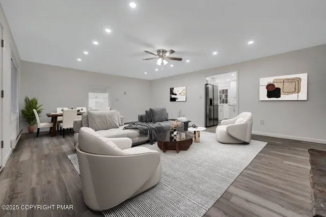 a kitchen with white cabinets and sink