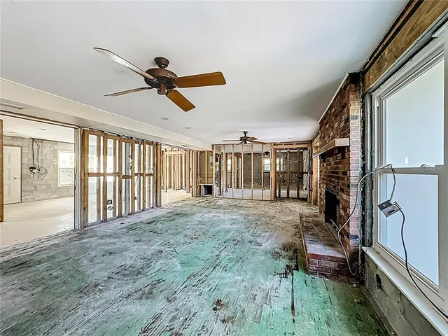 a view of a bathroom with sink shower and mirror
