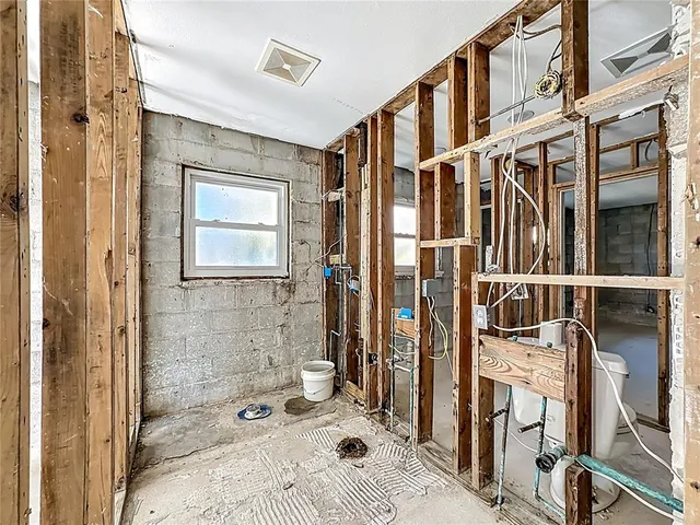a bathroom with a sink a mirror and a shower