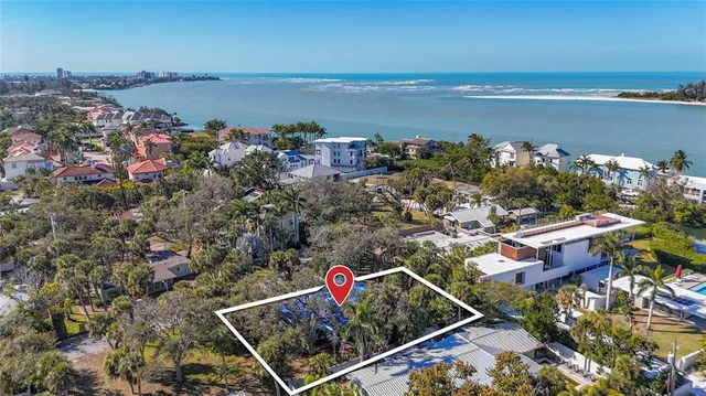 an aerial view of a houses with an outdoor seating