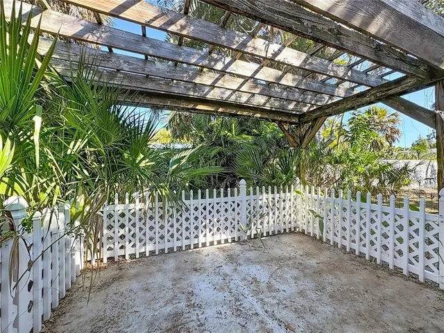 a view of a yard along with trees