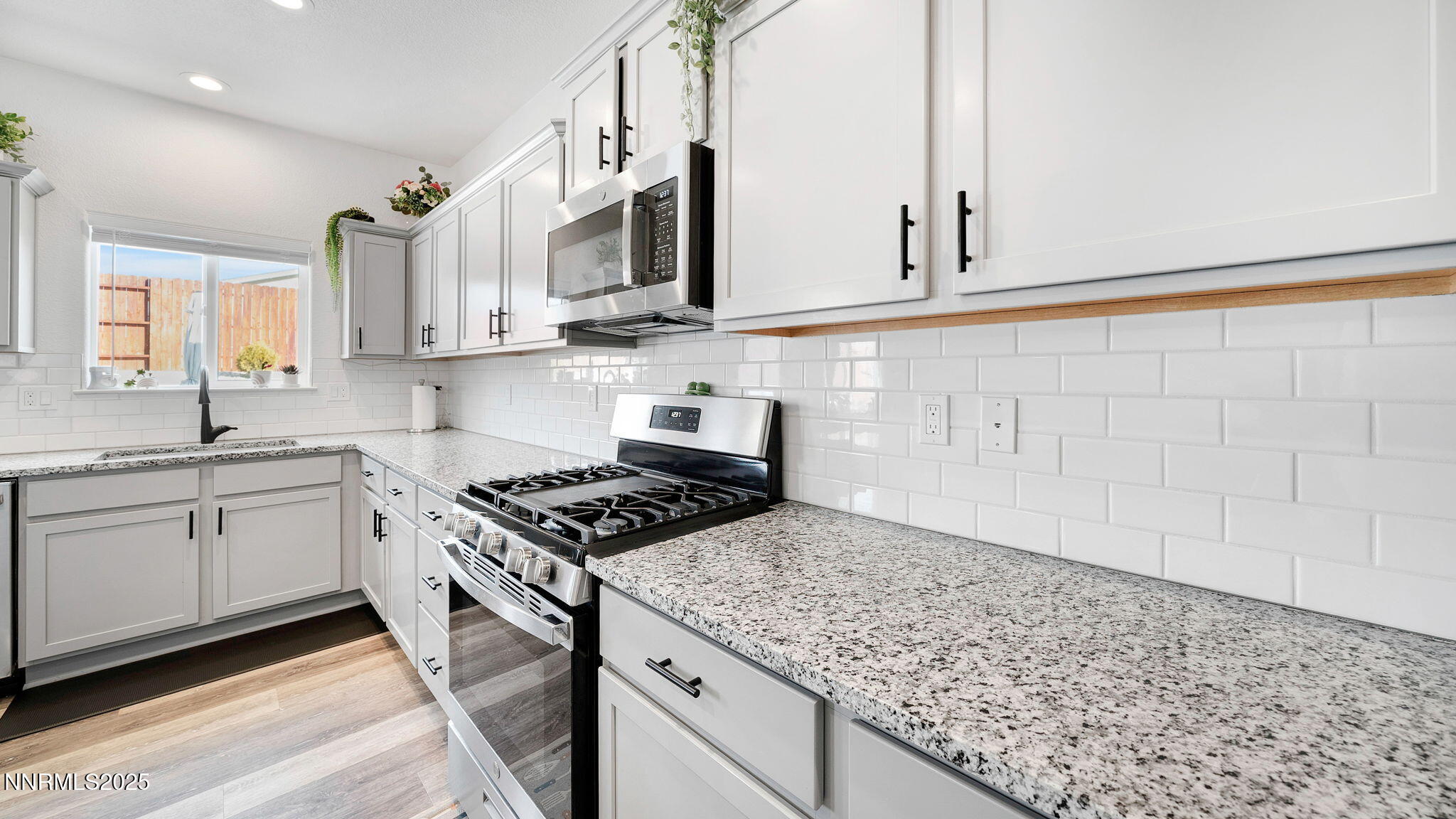 17821 Rose Meadow Court Reno, NV 89508 - Photo 12 of 39 a kitchen with stainless steel appliances granite countertop a sink stove and cabinets