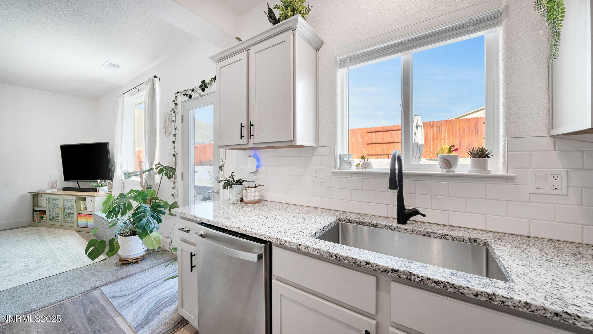 17821 Rose Meadow Court Reno, NV 89508 - Photo 13 of 39 a kitchen with a sink a counter top space and a window