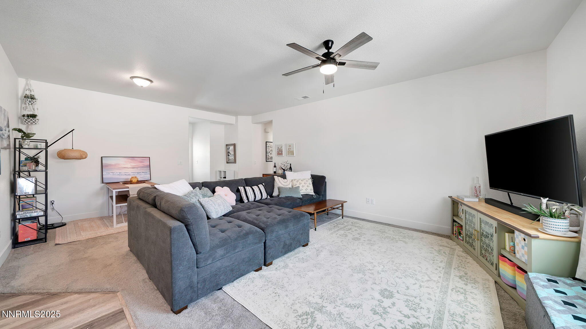 17821 Rose Meadow Court Reno, NV 89508 - Photo 16 of 39 a living room with furniture and a flat screen tv