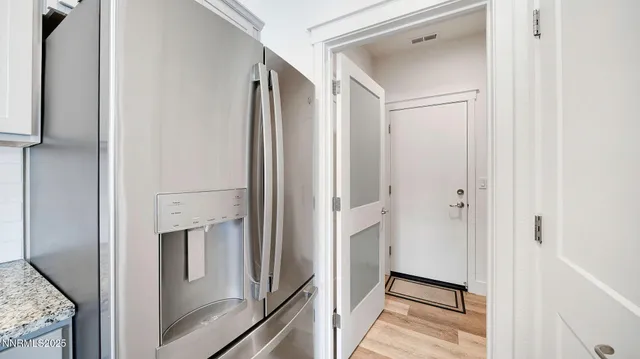 a view of a kitchen from the hallway