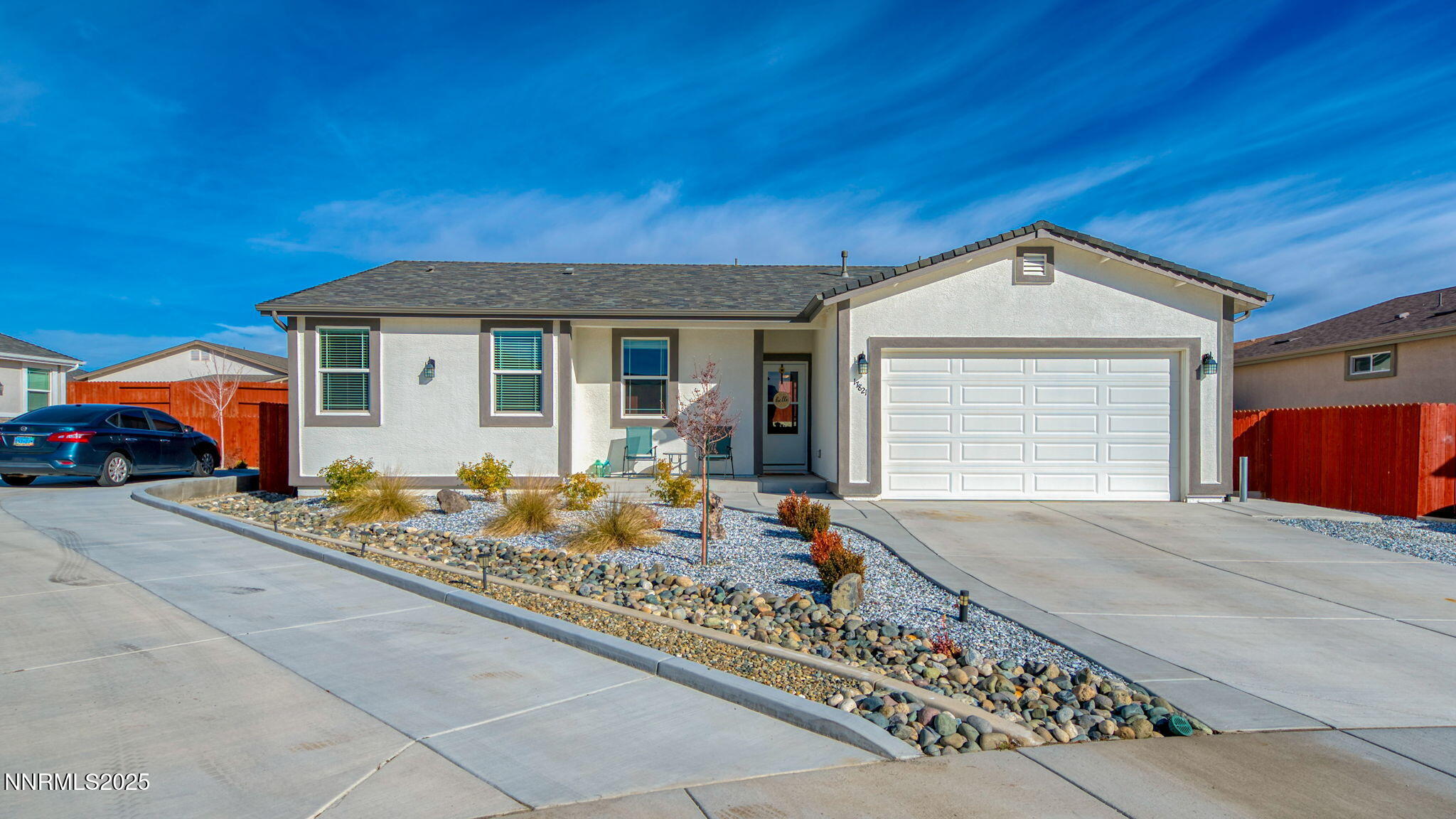 17821 Rose Meadow Court Reno, NV 89508 - Photo 2 of 39 a front view of a house with garage