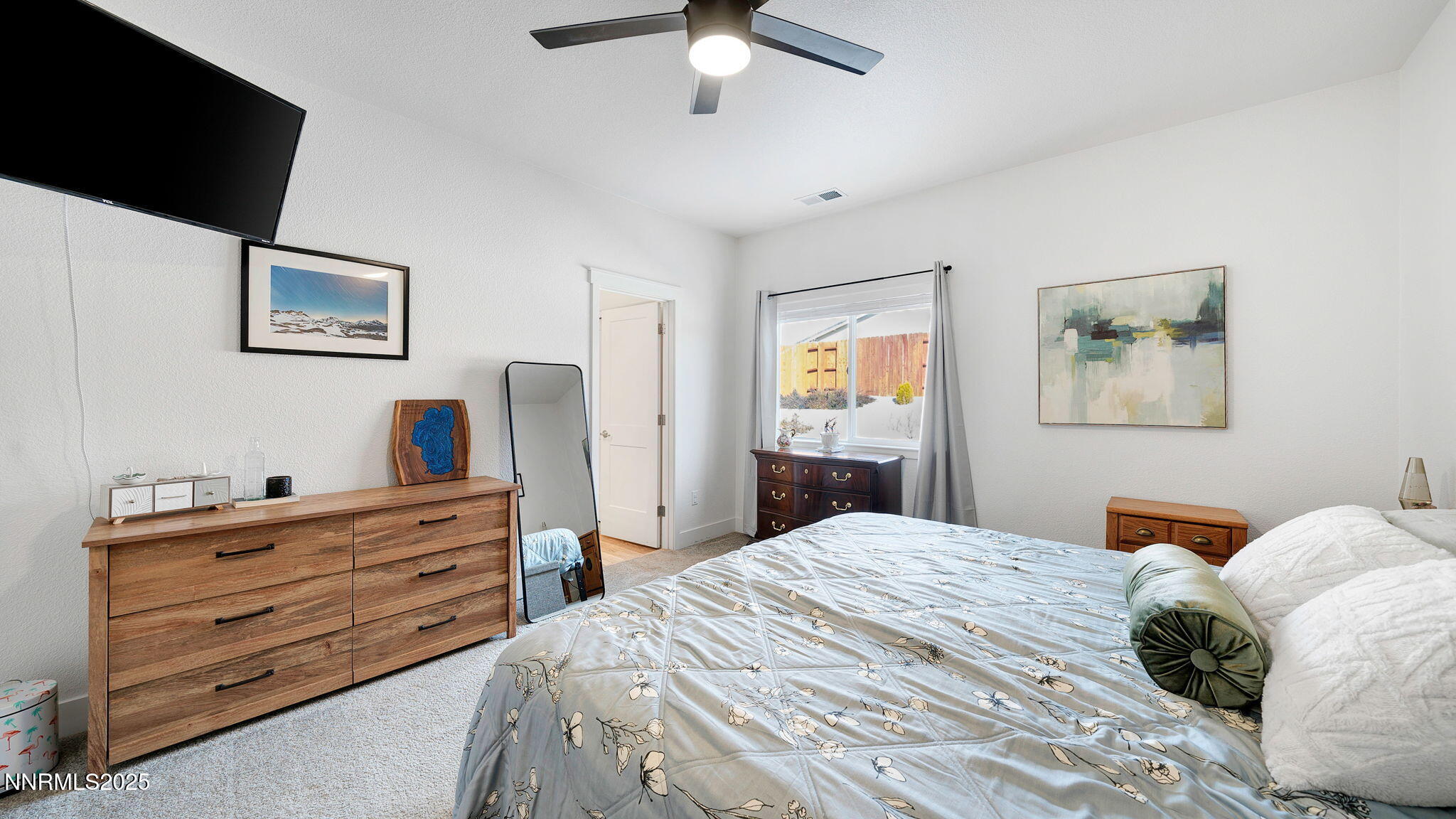 17821 Rose Meadow Court Reno, NV 89508 - Photo 24 of 39 a bedroom with a bed and a dresser