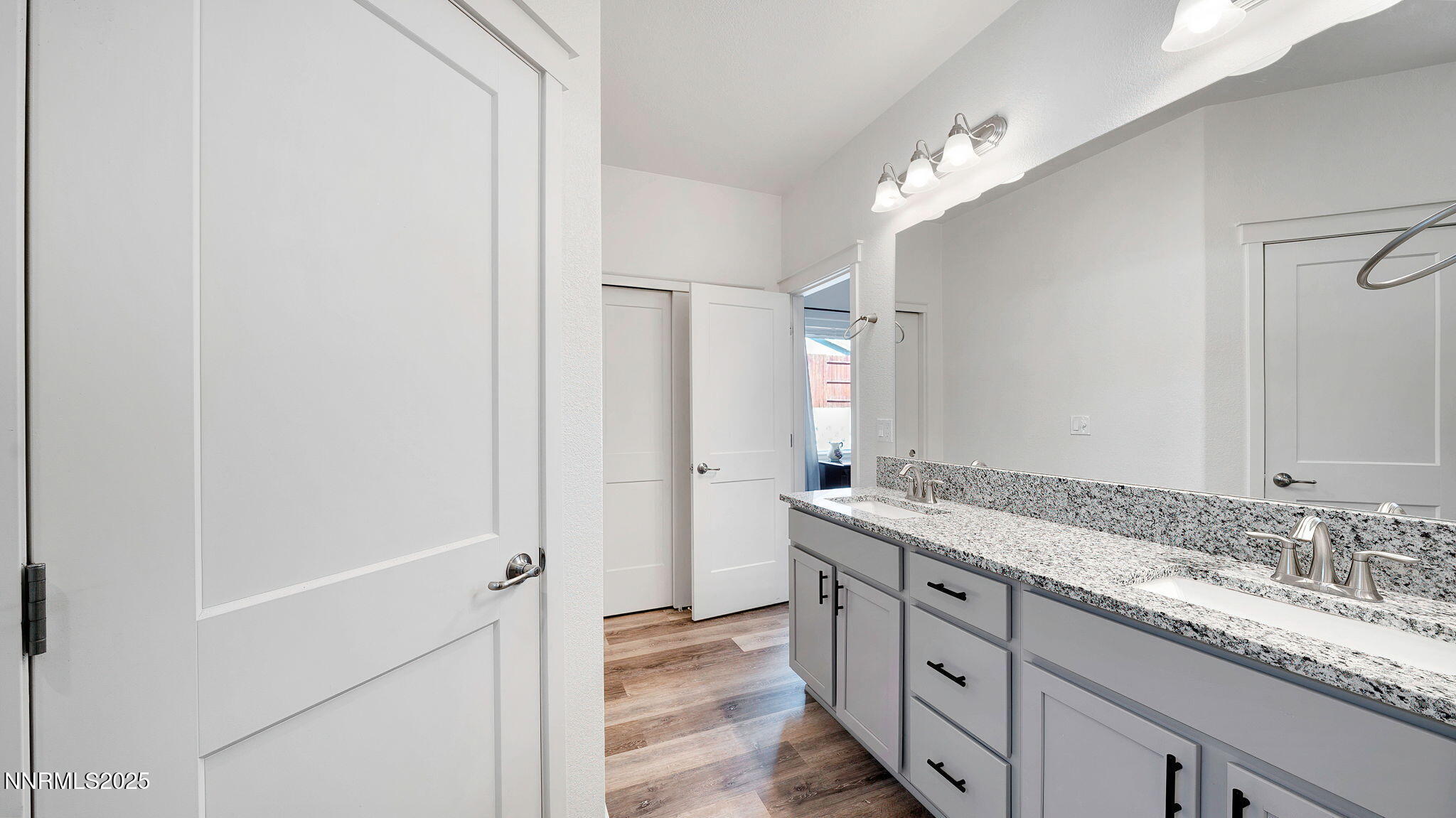 17821 Rose Meadow Court Reno, NV 89508 - Photo 27 of 39 a bathroom with a granite countertop sink and a mirror