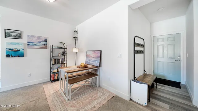 a bedroom with furniture and a window