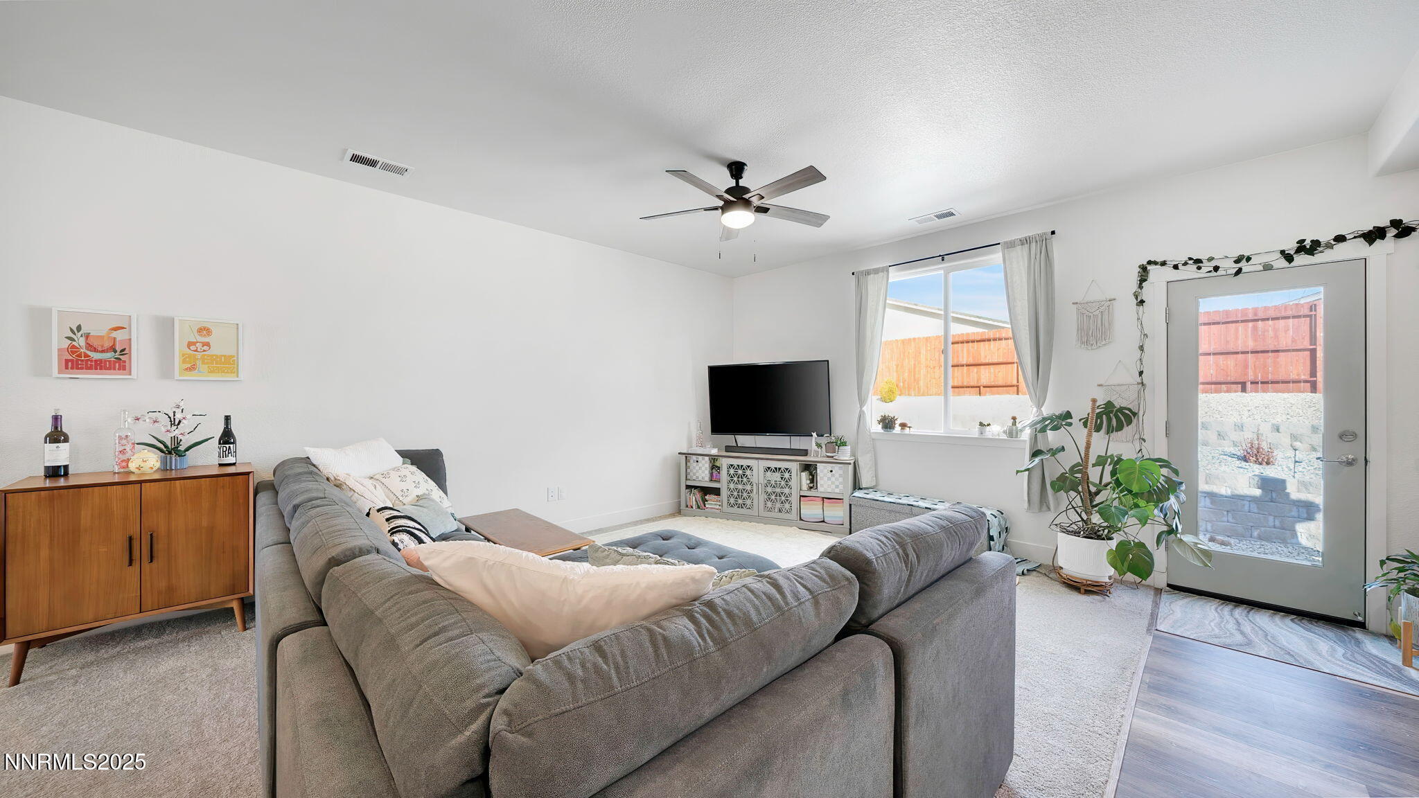 17821 Rose Meadow Court Reno, NV 89508 - Photo 7 of 39 a bedroom with a bed and a couch