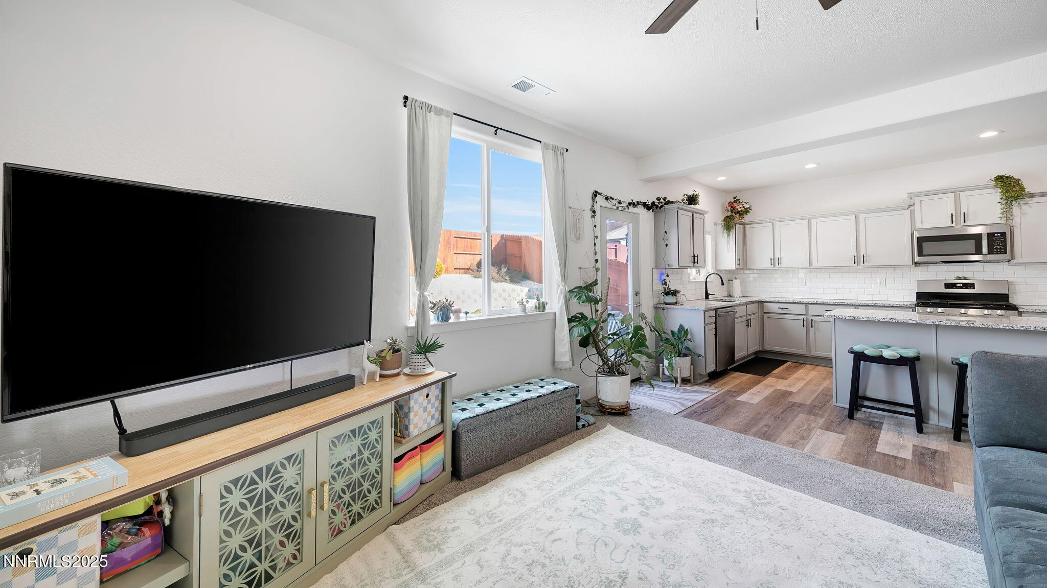 17821 Rose Meadow Court Reno, NV 89508 - Photo 9 of 39 a living room with furniture and a flat screen tv