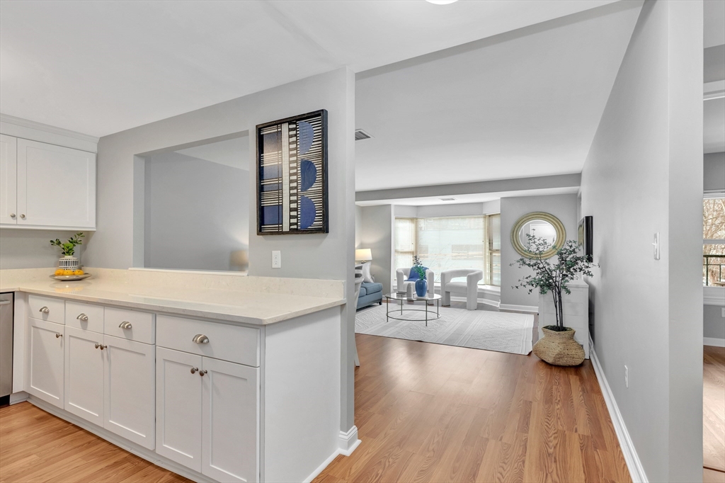 1 Watermill Place, Unit 312 Arlington, MA 02476 - Photo 3 of 33 a very nice looking living room with wooden floor
