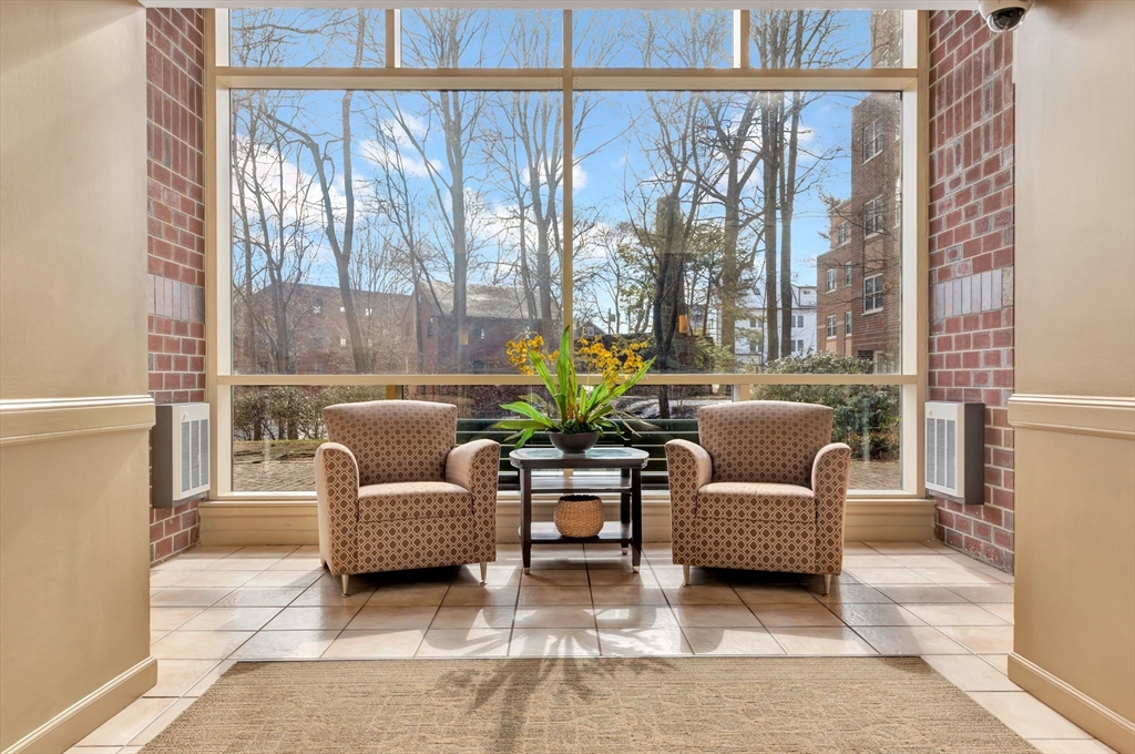 1 Watermill Place, Unit 312 Arlington, MA 02476 - Photo 32 of 33 a living room with furniture and a large window