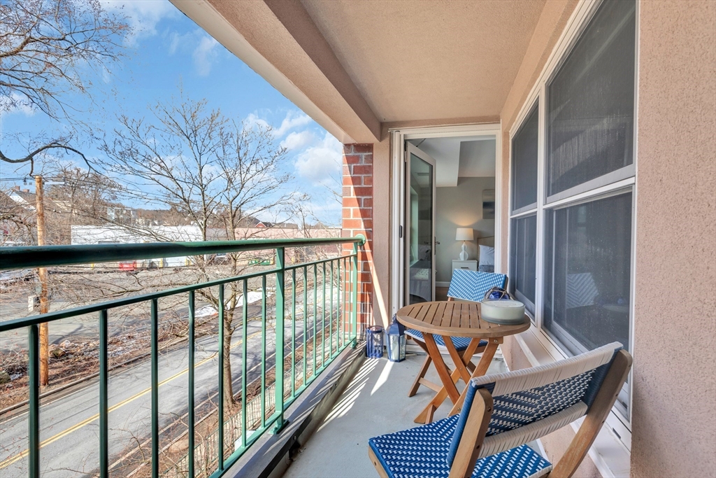 1 Watermill Place, Unit 312 Arlington, MA 02476 - Photo 10 of 33 a view of a balcony with furniture