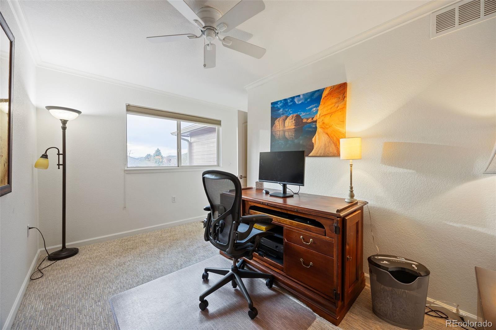 8558 Gold Peak Lane, Unit B Highlands Ranch, CO 80130 - Photo 20 of 41 a view of a workspace with furniture and a window