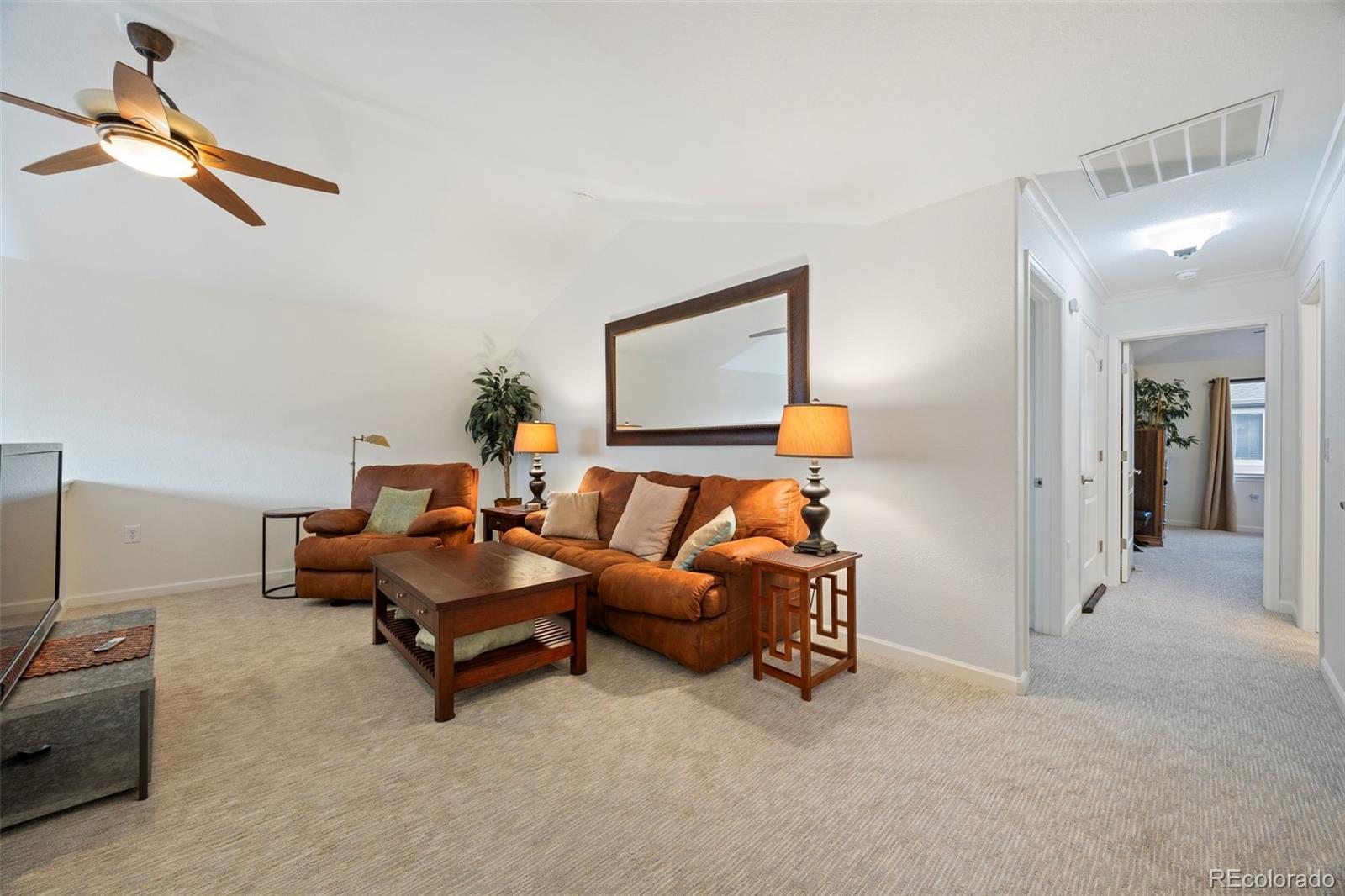 8558 Gold Peak Lane, Unit B Highlands Ranch, CO 80130 - Photo 21 of 41 a living room with furniture