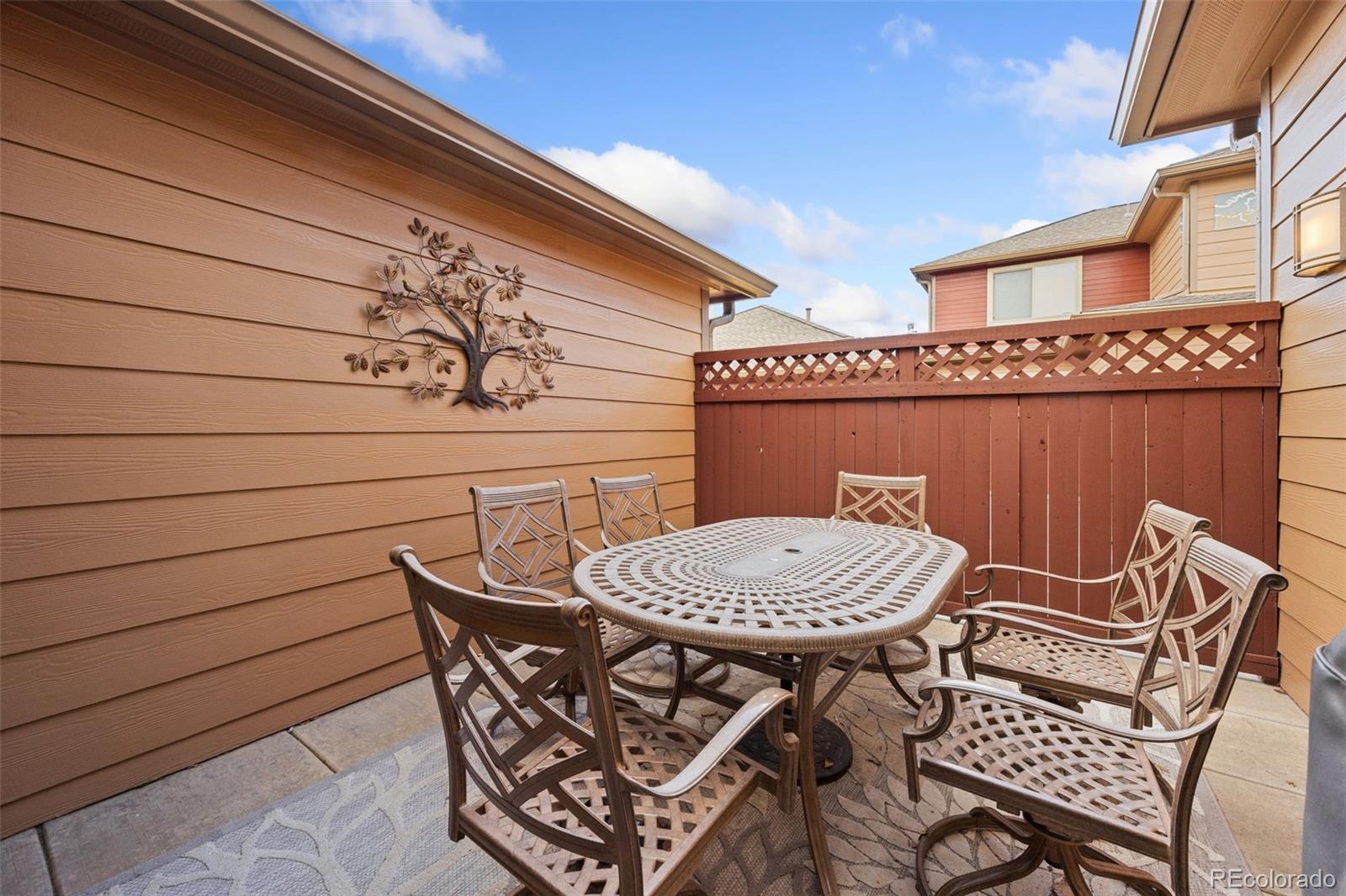 8558 Gold Peak Lane, Unit B Highlands Ranch, CO 80130 - Photo 28 of 41 a view of a chairs and table in patio
