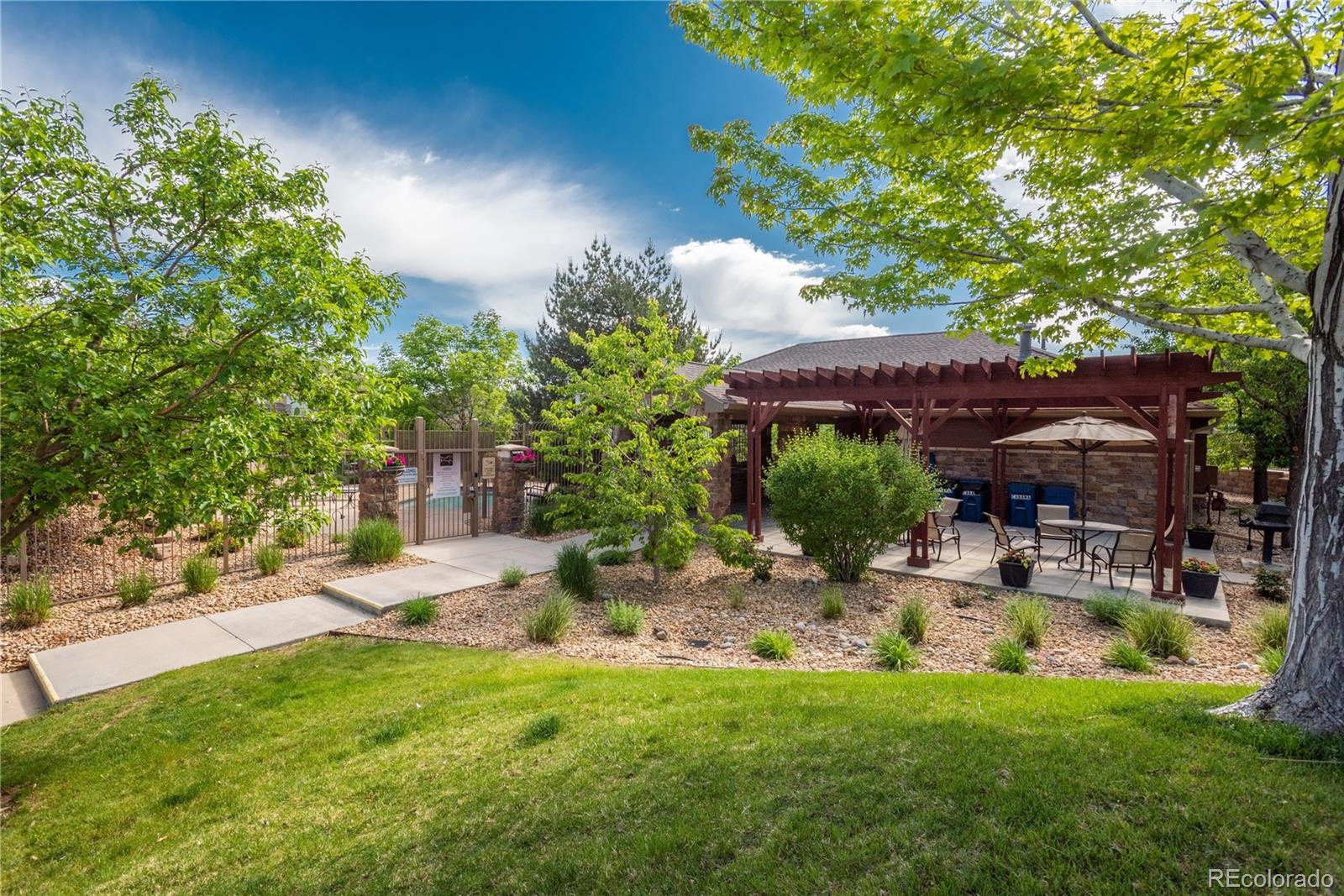 8558 Gold Peak Lane, Unit B Highlands Ranch, CO 80130 - Photo 31 of 41 a view of backyard with outdoor seating and green space