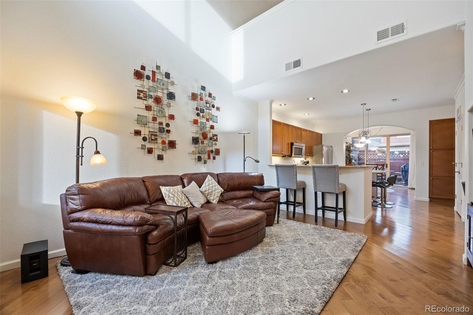 8558 Gold Peak Lane, Unit B Highlands Ranch, CO 80130 - Photo 6 of 41 a living room with furniture and kitchen view