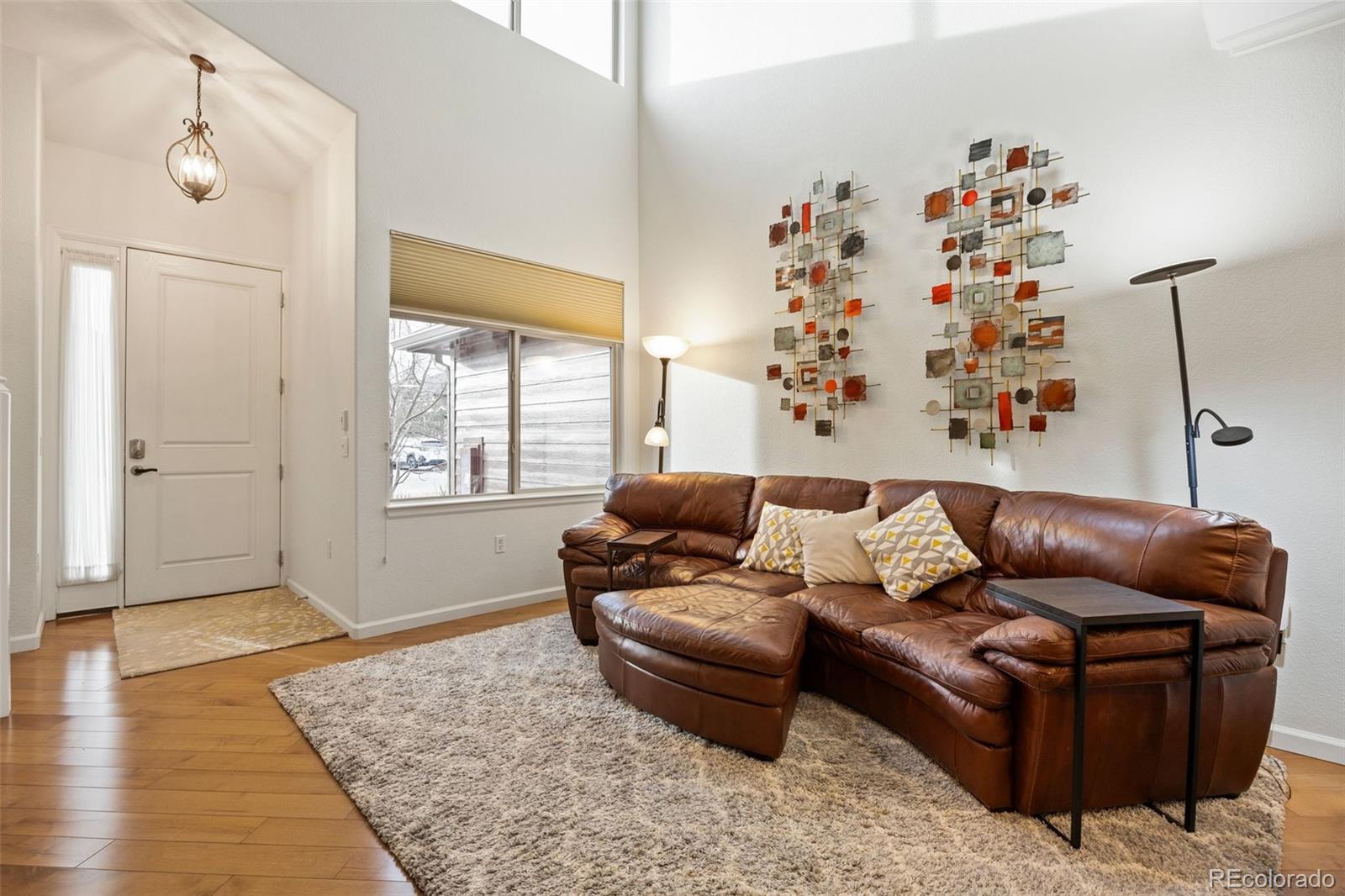 8558 Gold Peak Lane, Unit B Highlands Ranch, CO 80130 - Photo 7 of 41 a living room with furniture and a window