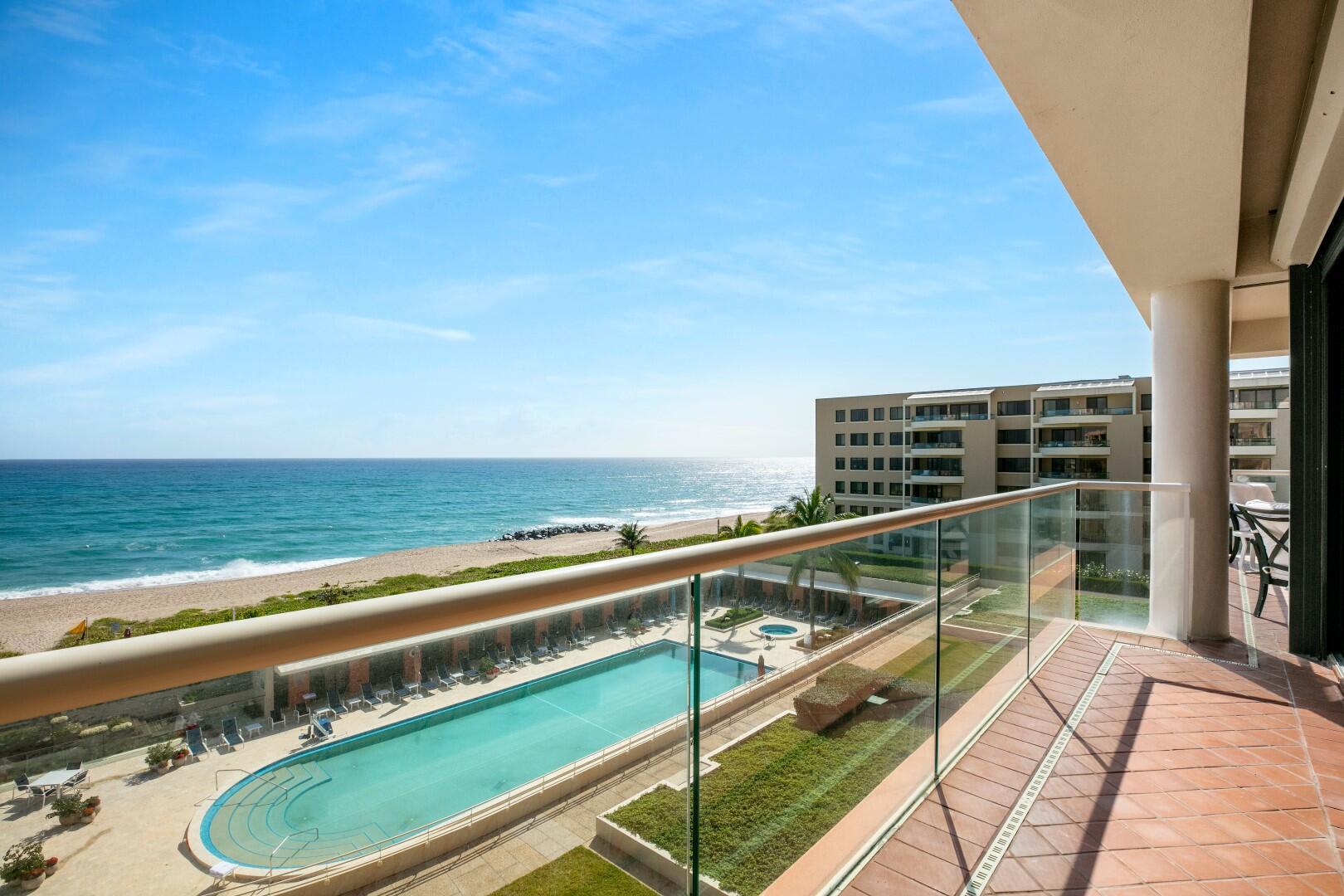 a view of a balcony with ocean view