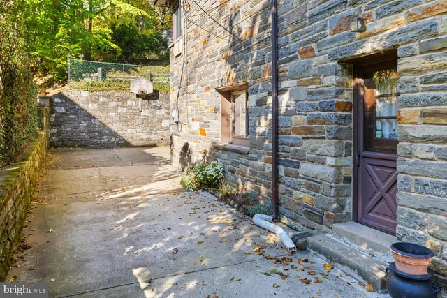 a backyard of a house with outdoor seating