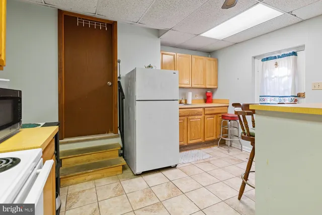 a utility room with cabinets and furniture
