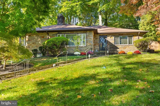 a view of a house with a yard porch and sitting area