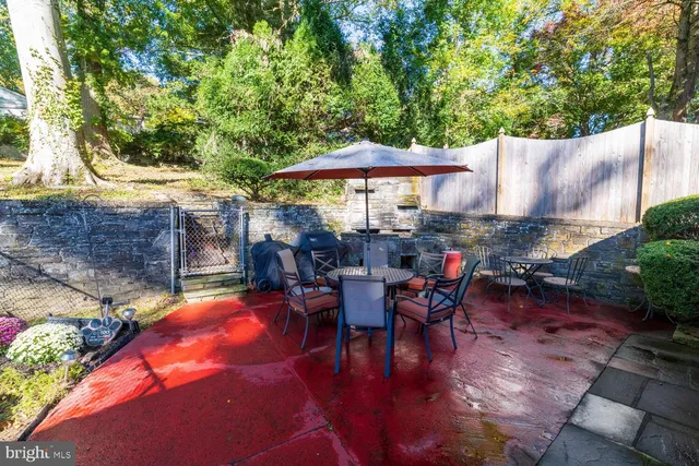 an outdoor space with patio furniture and umbrella