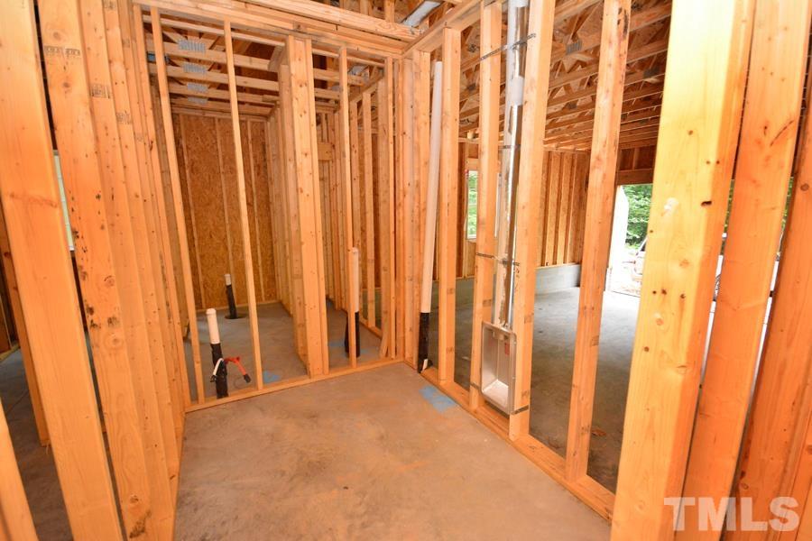 811 Ned Moore Road Timberlake, NC 27583 - Photo 29 of 33 a view of a bathroom with shower curtain