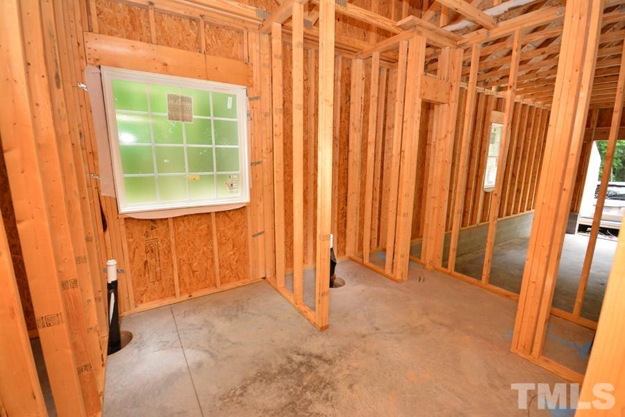 811 Ned Moore Road Timberlake, NC 27583 - Photo 31 of 33 a view of an empty room with a window