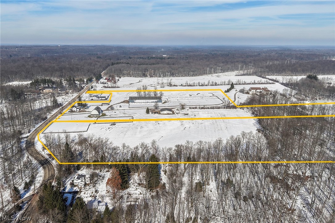 9455 Robinson Road Chardon, OH 44024 - Photo 24 of 33 Aerial view of property's location with property boundaries highlighted and a heavily wooded area