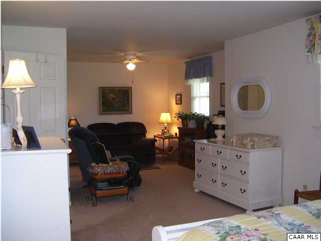 182 Childs Road Stanardsville, VA 22973 - Photo 13 of 27 a living room with furniture and a mirror