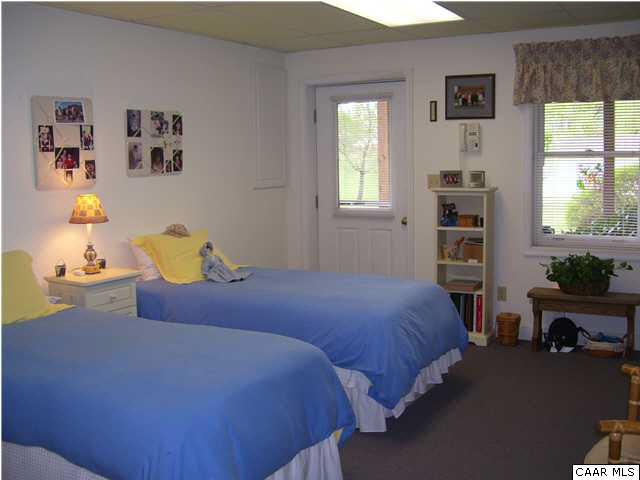 182 Childs Road Stanardsville, VA 22973 - Photo 23 of 27 a bedroom with a bed and a window