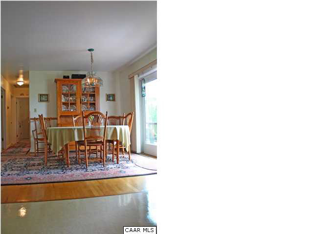 182 Childs Road Stanardsville, VA 22973 - Photo 9 of 27 a dining room with furniture and chandelier