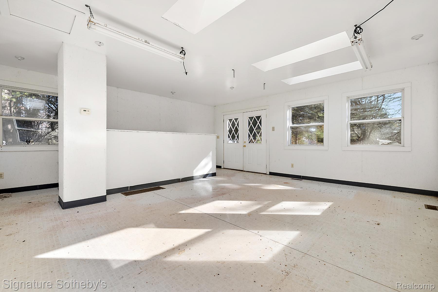 16385 17 1/2 Mile Road Marshall, MI 49068 - Photo 30 of 31 Empty room with a skylight and concrete flooring
