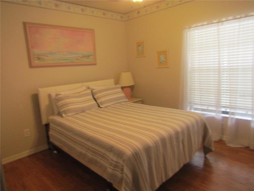 4137 Bella Pasque Venice, FL 34293 - Photo 18 of 30 a bedroom with a bed and a window