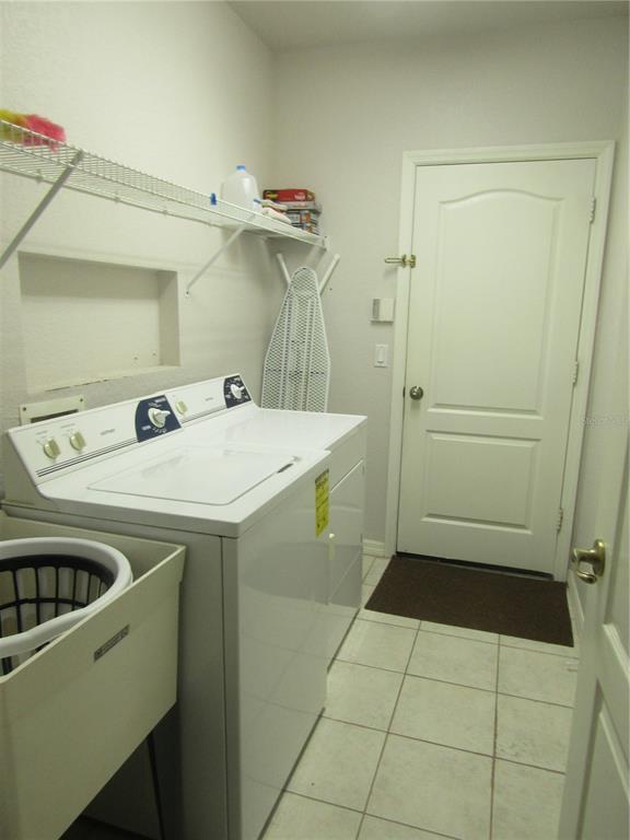 4137 Bella Pasque Venice, FL 34293 - Photo 21 of 30 a utility room with a sink washer and dryer