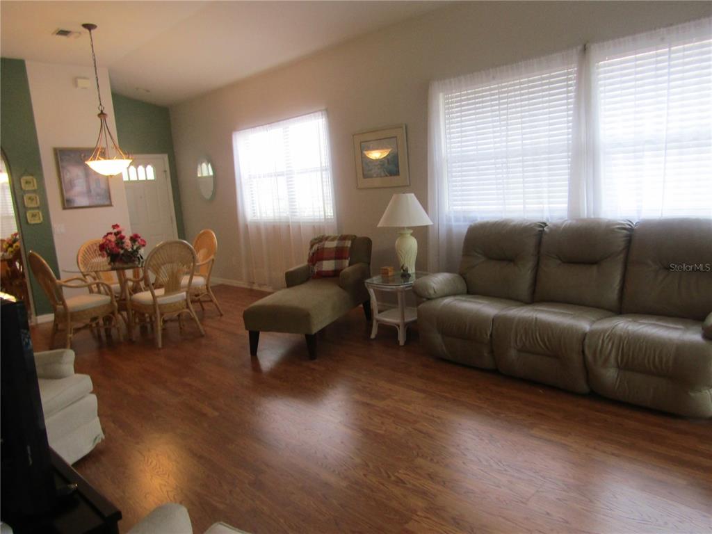 4137 Bella Pasque Venice, FL 34293 - Photo 5 of 30 a living room with furniture and a large window
